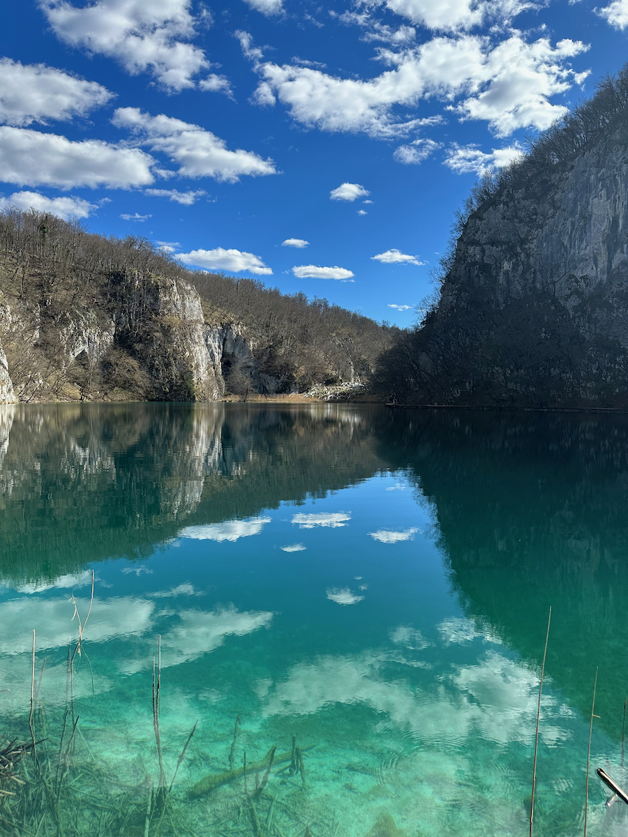 Cloudy sky reflection on Plitvice Lakes National Park in Croatia