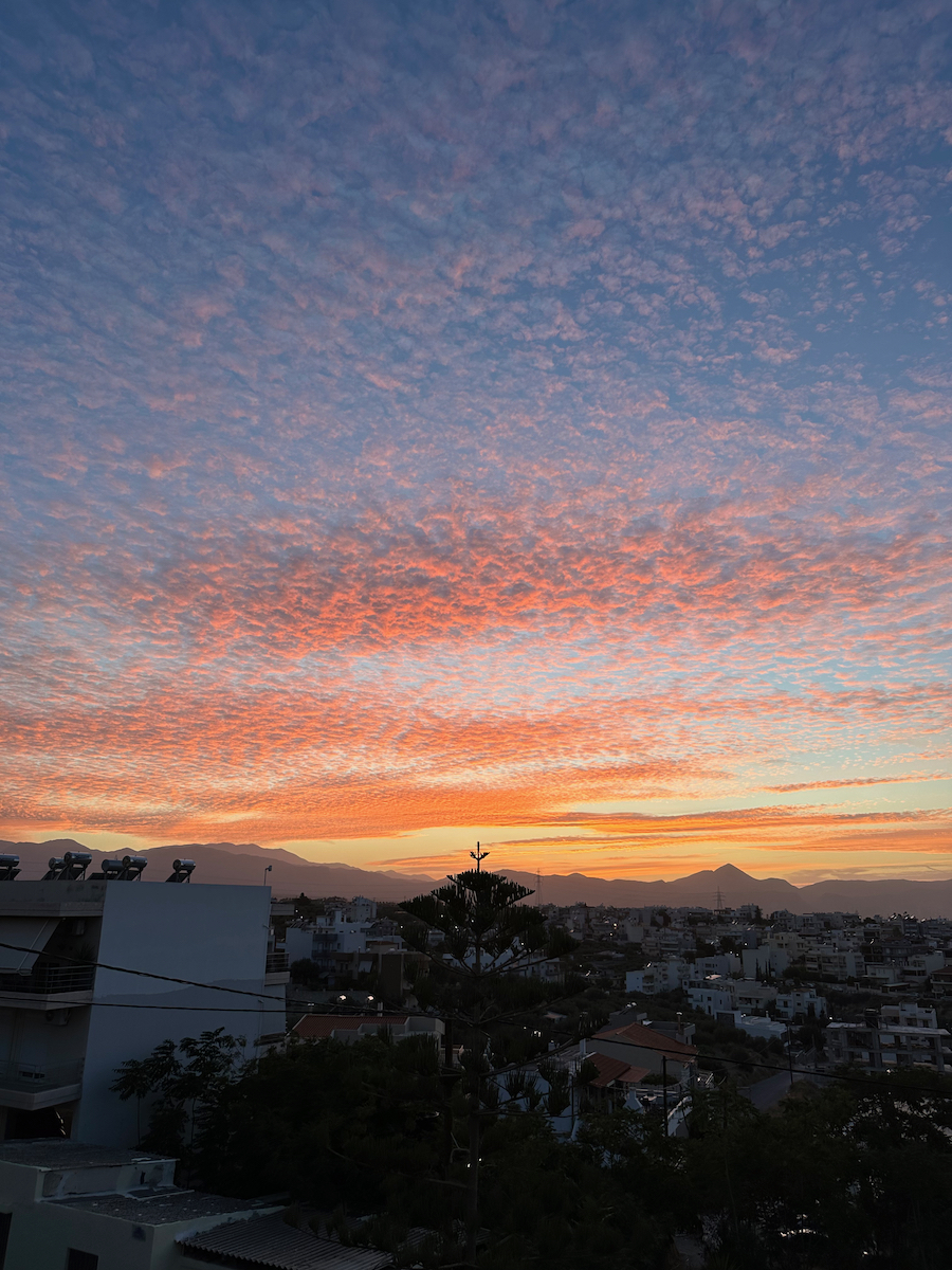 Blue and orange sunset over scattered clouds